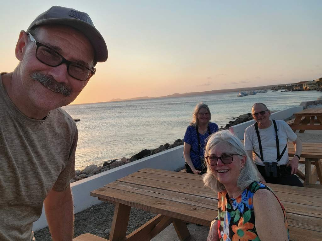 Group selfie ocean wall